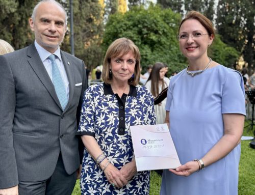 The President of Mozarteum Hellas presents the first copy of the commemorative book for the fifth anniversary of the organization